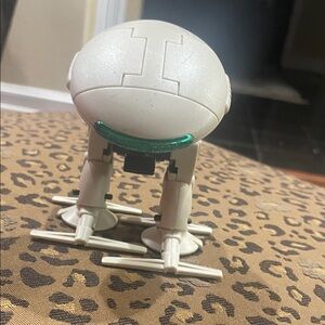 White Robot Toy with Green Details